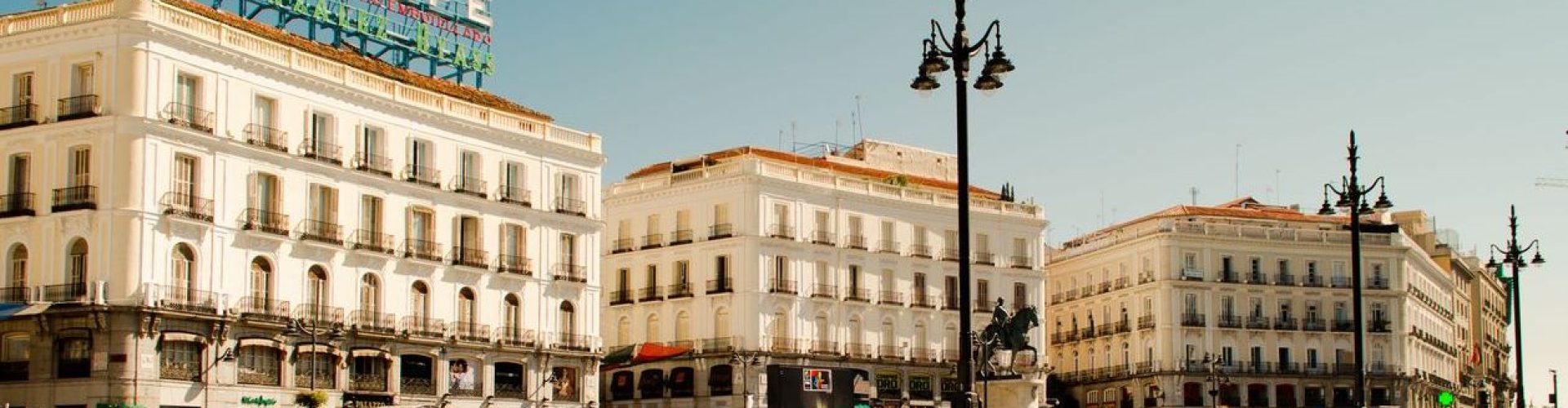 MADRID, SPAIN - AUGUST 5, 2014: Architecture of Madrid. Unknown tourists at square Puerta del Sol.